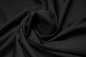 Ткань трикотаж джерси облегченный однотон. черный ш 1,5 (вискоза 54% тенсел 30% нейлон 13% эл 3%)