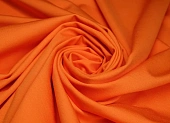 Ткань трикотаж джерси однотон. оранжевый ш 1,5 (вискоза 54% тенсель 10% нейлон 33% эл 3%)